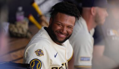 Milwaukee Brewers' Jackson Chourio smiles in the dougout during the fourth inning of a spring training baseball game against the Kansas City Royals , Thursday, Feb. 27, 2025, in Phoenix. (AP Photo/Carolyn Kaster)