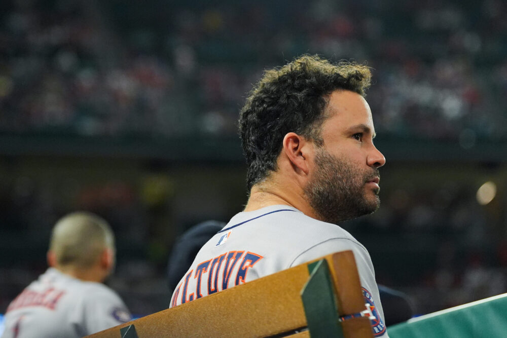 Houston Astros' Jose Altuve watches from the dugout