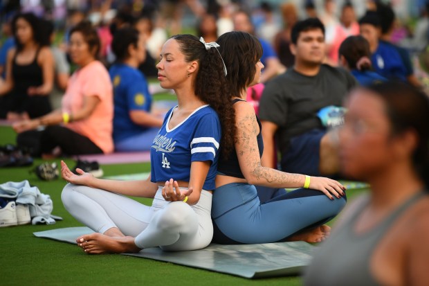 Yoga enthusiasts participate in the Yoga on the Field event...