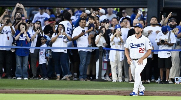Dodgers starting pitcher Clayton Kershaw stretches before their game against...