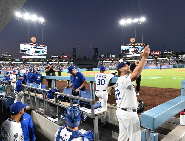 Dodgers starting pitcher Clayton Kershaw blows a kiss to his...