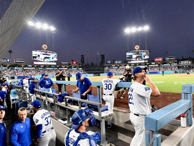 Dodgers starting pitcher Clayton Kershaw blows a kiss to his...