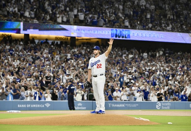 Dodgers starting pitcher Clayton Kershaw acknowledges the crowd before the...