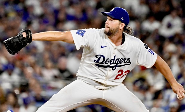 Dodgers starting pitcher Clayton Kershaw throws to the plate during...