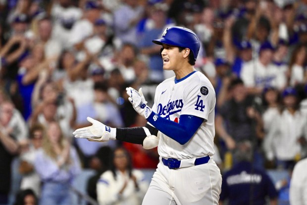 Shohei Ohtani #17 of the Los Angeles Dodgers celebrates after...