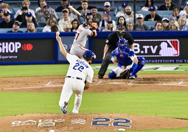 Dodgers starting pitcher Clayton Kershaw throws to the plate during...