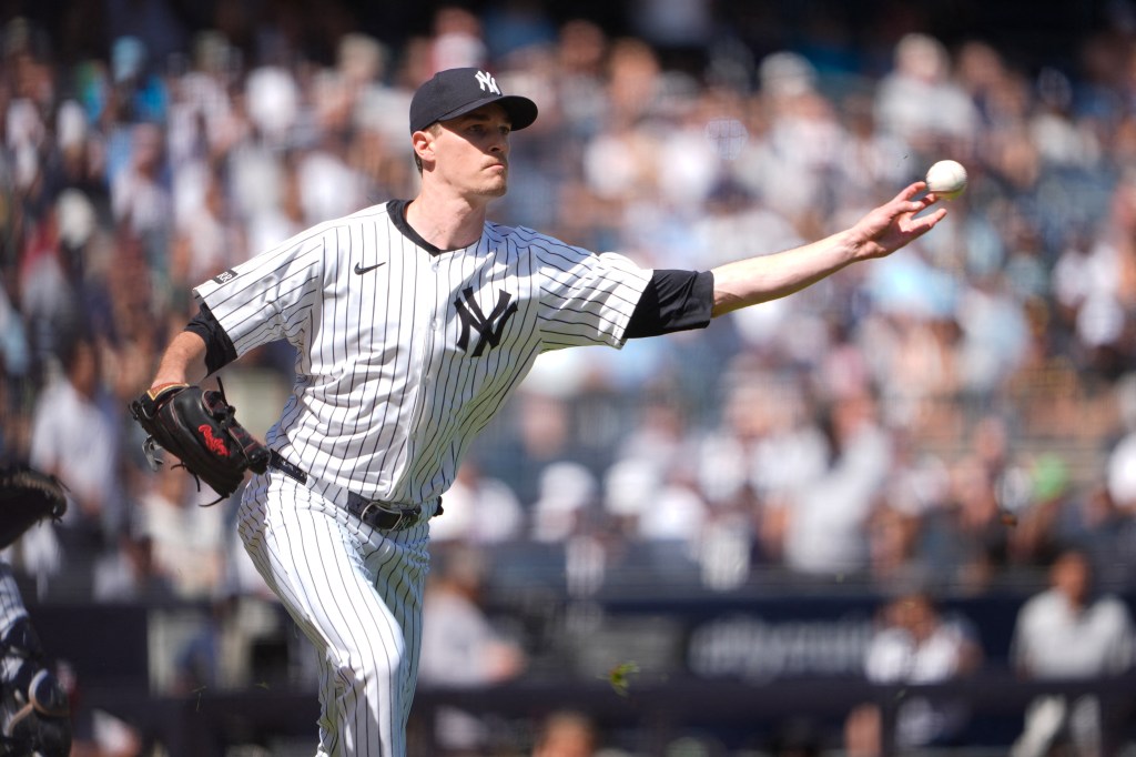 New York Yankees baseball pitcher throwing a pitch.