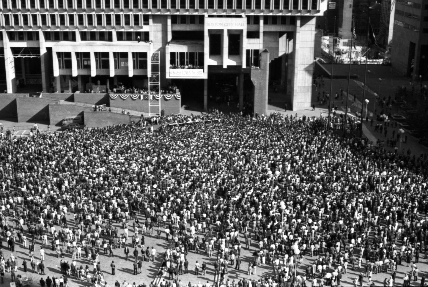 Scores of Red Sox fans crowded into City Hall Plaza for a team rally the day after Game 7, even after their team failed to win the World Series.