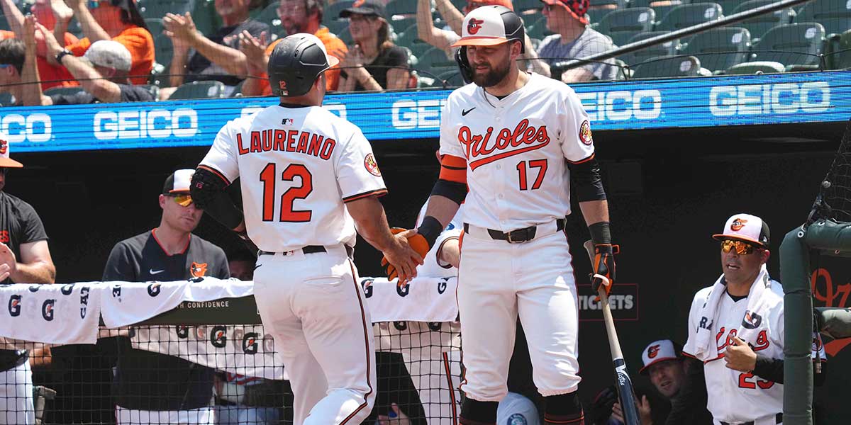Baltimore Orioles designated hitter Ramon Laureano (12) greeted by outfielder Colton Cowser (17) after scoring during the first inning against the Toronto Blue Jays at Oriole Park at Camden Yards.