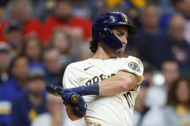 Milwaukee Brewers' Sal Frelick (10) hits a two-run single during the first inning of a baseball game against the Philadelphia Phillies, Wednesday, Sept. 3, 2025, in Milwaukee. (AP Photo/Jeffrey Phelps)