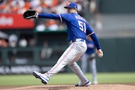 Texas Rangers pitcher Tyler Mahle throws during the first inning of a baseball game against...