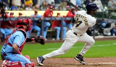 Playoff-bound Brewers rally from 5 runs down to beat skidding Cardinals 9-8 in 10 innings