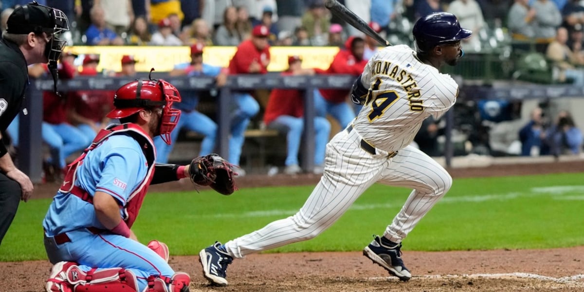 Playoff-bound Brewers rally from 5 runs down to beat skidding Cardinals 9-8 in 10 innings