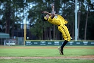 Savannah Bananas' dancing first base coach Maceo Harrisoin performs a back-flip in the...