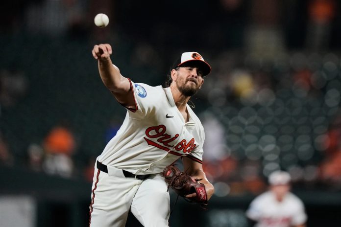 Baltimore Orioles starting pitcher Dean Kremer delivers during the first inning of a baseball game against the Tampa Bay Rays, Tuesday, Sept. 23, 2025, in Baltimore. (AP Photo/Stephanie Scarbrough)
