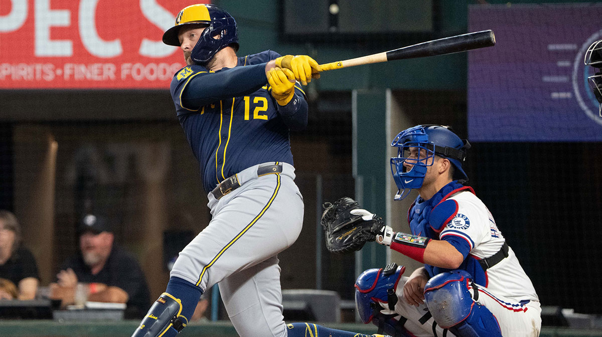 Milwaukee Brewers first baseman Rhys Hoskins (12) follows through on his RBI single against the Texas Rangers during the sixth inning at Globe Life Field.