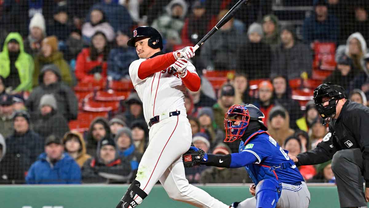 Boston Red Sox right fielder Rob Refsnyder (30) hits a single against the Toronto Blue Jays during the sixth inning at Fenway Park.