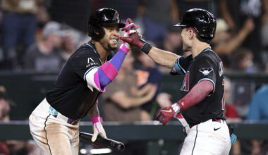 Arizona Diamondbacks' Corbin Carroll, right, high-fives Ketel Marte, as the D-backs remain in the N...