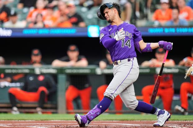 Colorado's Ezequiel Tovar (14) strikes out swinging during the first inning of a baseball game against the Baltimore Orioles, Saturday, July 26, 2025, in Baltimore. (AP Photo/Stephanie Scarbrough)