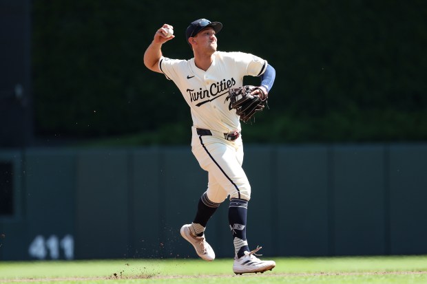 Brooks Lee #2 of the Minnesota Twins throws the ball to first base to get out Jose Iglesias #7 of the San Diego Padres during the seconds inning at Target Field on Aug. 31, 2025 in Minneapolis, Minnesota. (Photo by Matt Krohn/Getty Images)