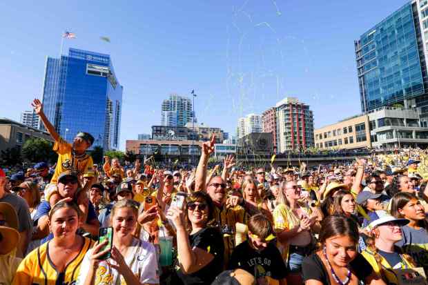 Savannah Bananas fans cheer as confetti explodes overhead before the Bananas' game against the Firefighters at Petco Park on Saturday, Sept. 6, 2025 in San Diego, CA. (Meg McLaughlin / The San Diego Union-Tribune)