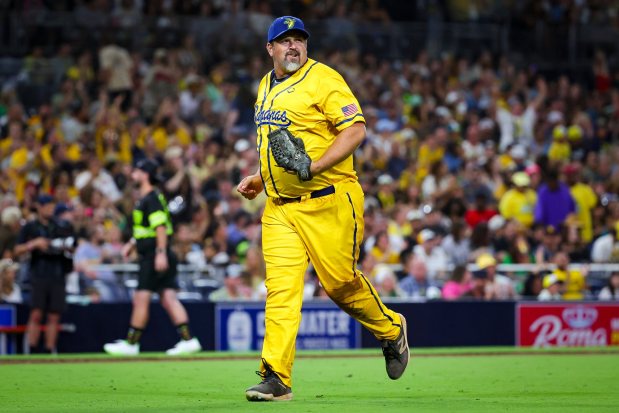 Former San Diego Padres pitcher Heath Bell smiles after pitching during the Savannah Bananas game against the Firefighters at Petco Park on Friday, Sept. 5, 2025 in San Diego, CA. (Meg McLaughlin / The San Diego Union-Tribune)