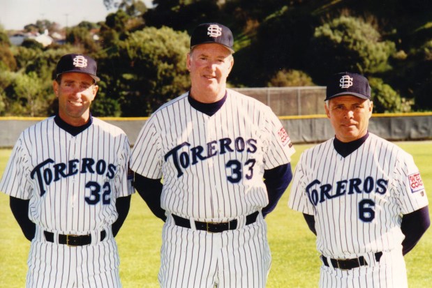 John Cunningham and his USD assistants pose in this undated photo. (USD athletics)