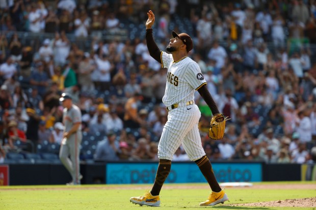 The Padres' Robert Suarez celebrates after getting the final out in the Padres' victory over the Giants on Thursday. (K.C. Alfred / The San Diego Union-Tribune)