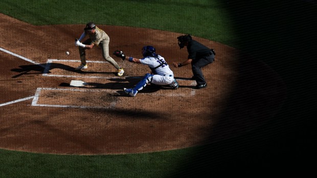 Jackson Merrill #3 of the San Diego Padres bunts against the Chicago Cubs during the fourth inning during game one of the NL Wild Card Series at Wrigley Field on Tuesday, Sept. 30, 2025 in Chicago, Illinois. (Meg McLaughlin / The San Diego Union-Tribune)