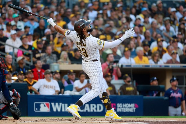 San Diego Padres' Fernando Tatis Jr.hits a two-run home run in the first inning against the Atlanta Braves in a wild card playoff game at Petco Park on Tuesday, Oct., 2024. (K.C. Alfred / The San Diego Union-Tribune)