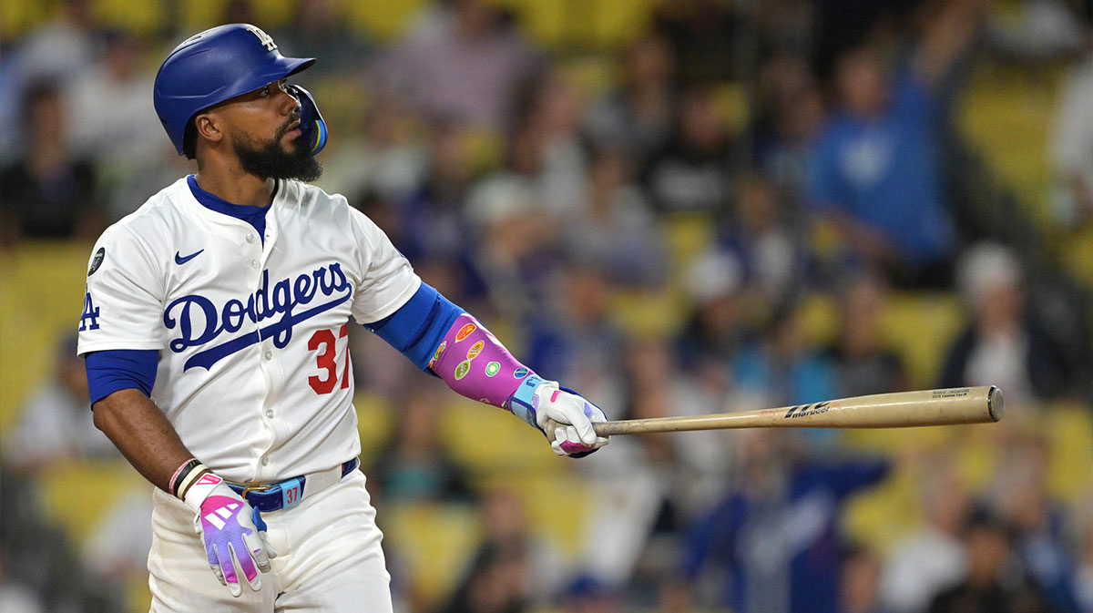 Los Angeles Dodgers right fielder Teoscar Hernandez (37) hits solo home run during the eighth inning against the Colorado Rockies at Dodger Stadium.