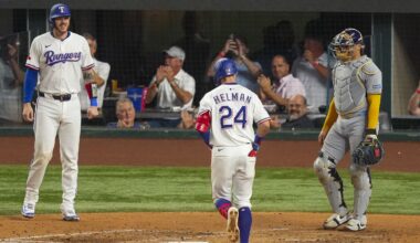 Texas Rangers' Michael Helman (24) prepares to cross home after hitting a two-run home run to score Jonah Heim, left, as Milwaukee Brewers catcher William Contreras, right, looks on during the fifth inning of a baseball game Tuesday, Sept. 9, 2025, in Arlington, Texas. (AP Photo/Julio Cortez)
