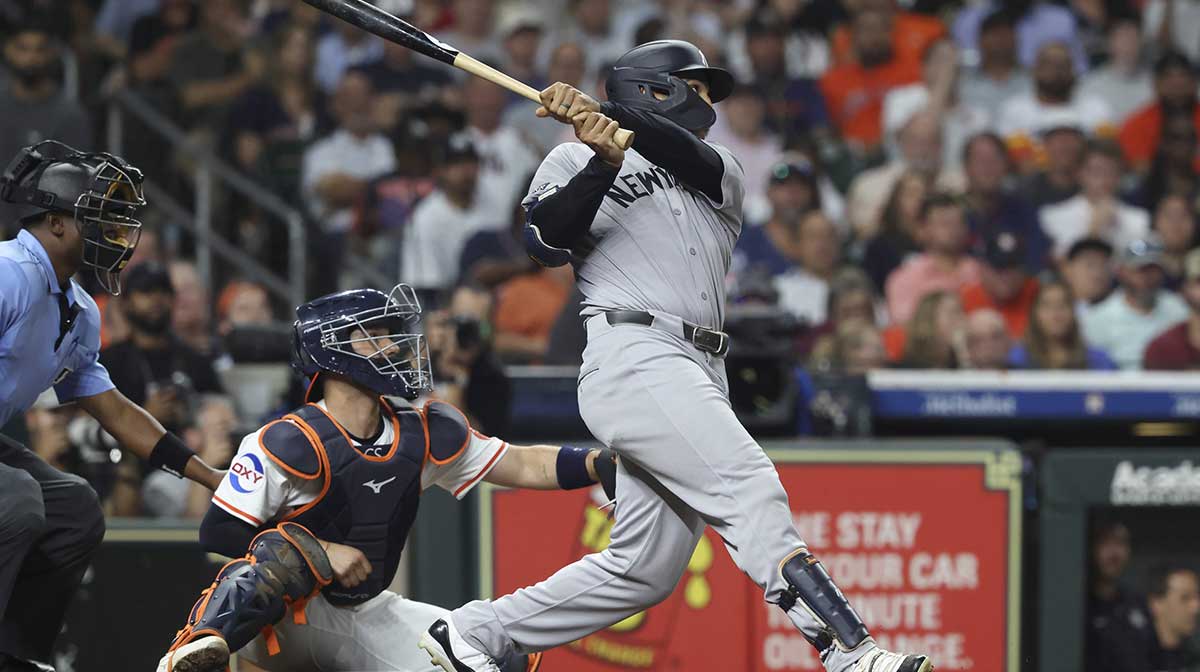 New York Yankees center fielder Trent Grisham (12) hits a grand slam during the fifth inning against the Houston Astros at Daikin Park.
