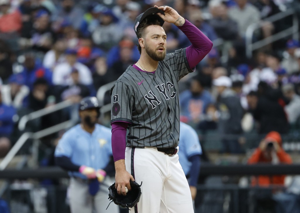 Tylor Megill wears a dejected expression during the Rays' five-run fourth inning during the Mets' loss.