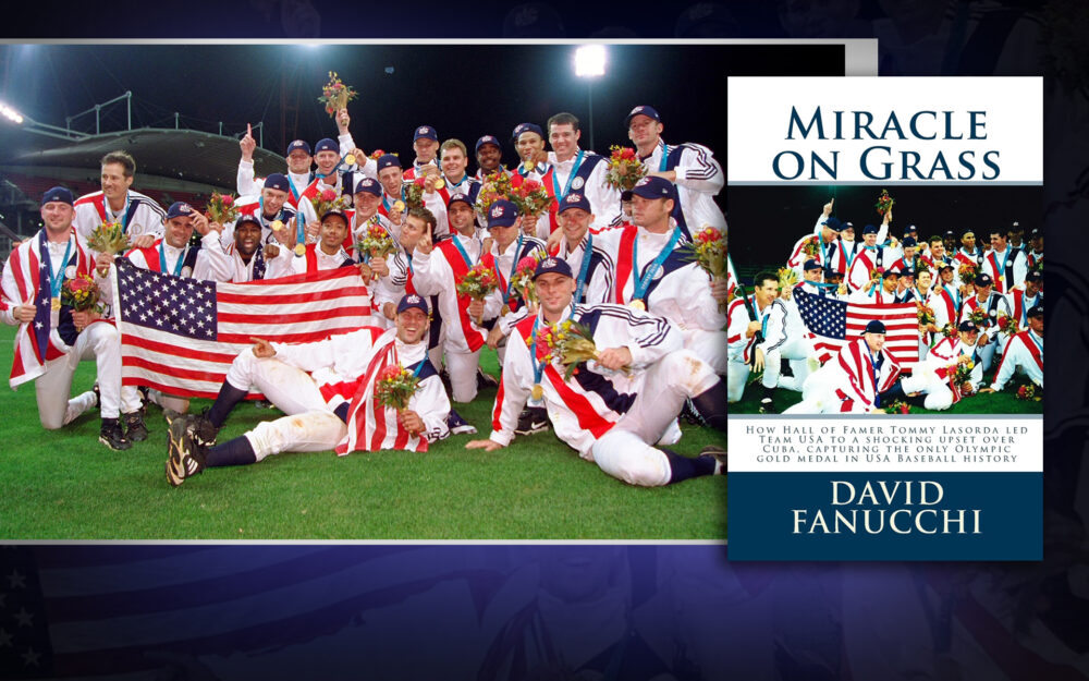 Members of Team USA next to the cover of the "Miracle on Grass" book