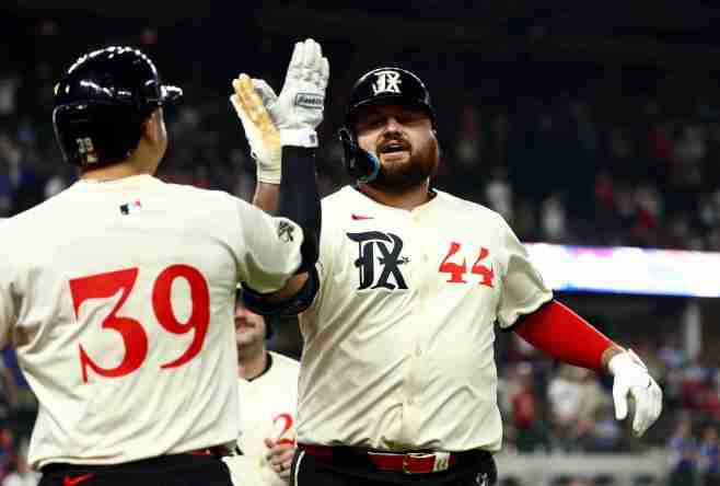 Sep 19, 2025; Arlington, Texas, USA; Texas Rangers first baseman Rowdy Tellez (44) celebrates with Texas Rangers second baseman Cody Freeman (39) after hitting a two-run home run during the tenth inning against the Miami Marlins at Globe Life Field. Mandatory Credit: Kevin Jairaj-Imagn Images