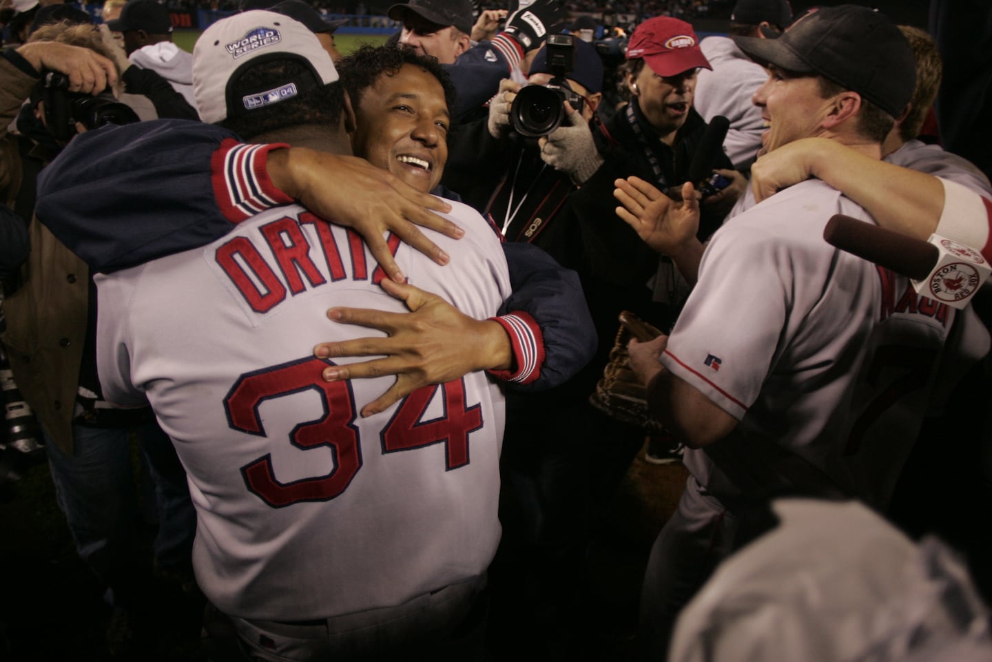 The demons were finally exorcised with the historic comeback in the 2004 ALCS. Martinez and David Ortiz hugged at Yankees Stadium after the clinching win.