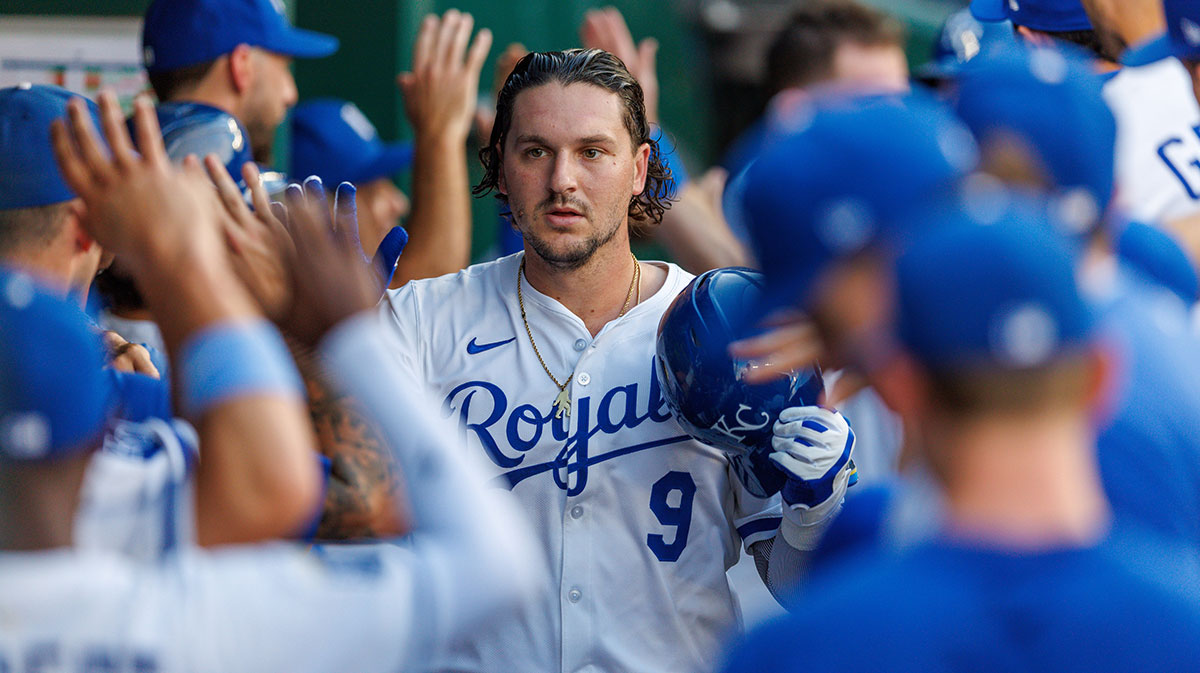 Aug 20, 2025; Kansas City, Missouri, USA; Kansas City Royals first base Vinnie Pasquantino (9) celebrates in the dugout after hitting a home run during the first inning against the Texas Rangers at Kauffman Stadium. Mandatory Credit: William Purnell-Imagn Images
