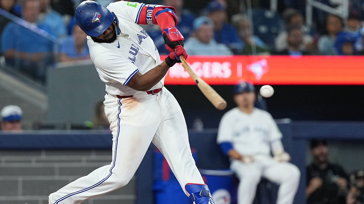 oronto, Ontario, CAN; Toronto Blue Jays first base Vladimir Guerrero Jr. (27) hits a single against the Houston Astros during the eighth inning at Rogers Centre. 