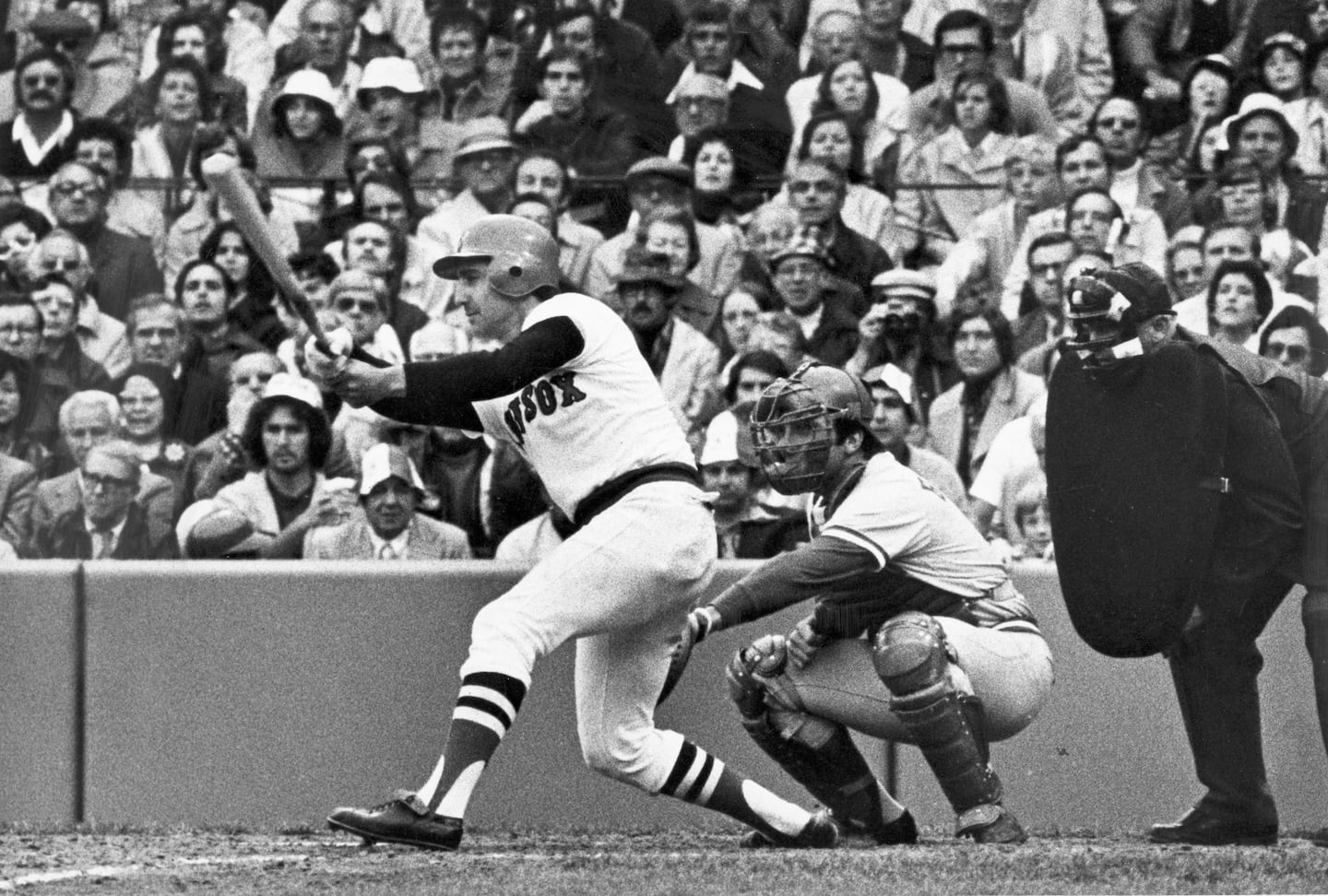 Red Sox third baseman Rico Petrocelli hit a two-run single in the seventh inning of Game 1 of the 1975 World Series against the Cincinnati Reds at Fenway Park.