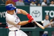 Texas Rangers left fielder Wyatt Langford (36) cracks his bat as he singles to center during...