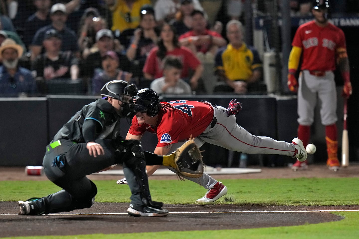 The Red Sox' Nate Eaton scores from first on a single by Nathaniel Lowe in the second inning.
