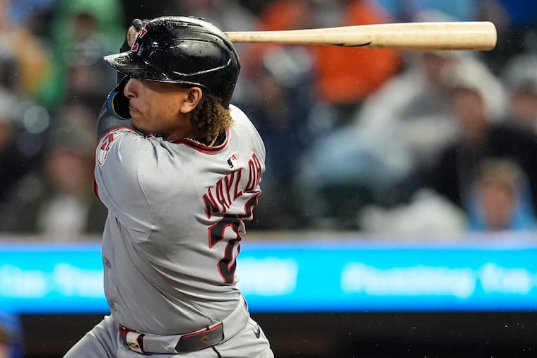Cleveland Guardians' Bo Naylor (23) hits a two-RBI single against the Minnesota Twins in the first inning of a baseball game, Friday, Sept. 19, 2025, in Minneapolis. (AP Photo/Mike Stewart)