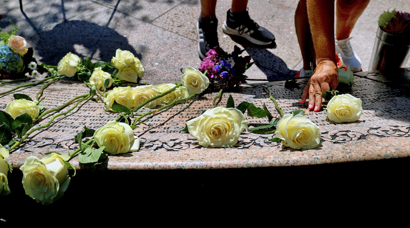 People honored Massachusetts victims of the Sept. 11 attacks in the Boston Public Garden yesterday.