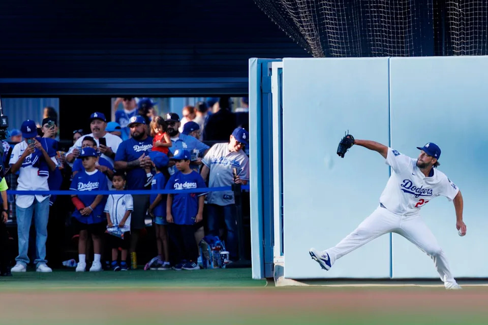 Dodgers pitcher Clayton Kershaw warms up in the outfield before the game against the Chicago White Sox on July 3.