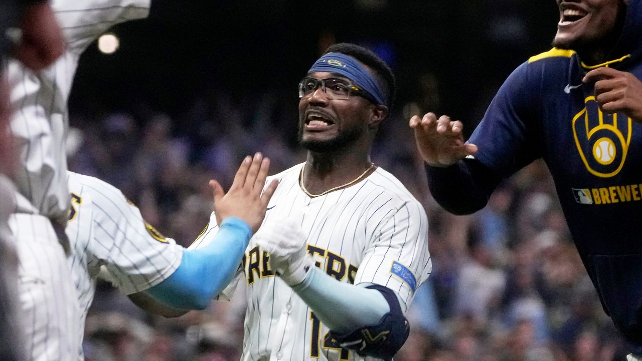 Milwaukee Brewers' Andruw Monasterio celebrates after hitting an RBI walk-off single during the 10th inning of a baseball game against the St. Louis Cardinals Saturday, Sept. 13, 2025, in Milwaukee.