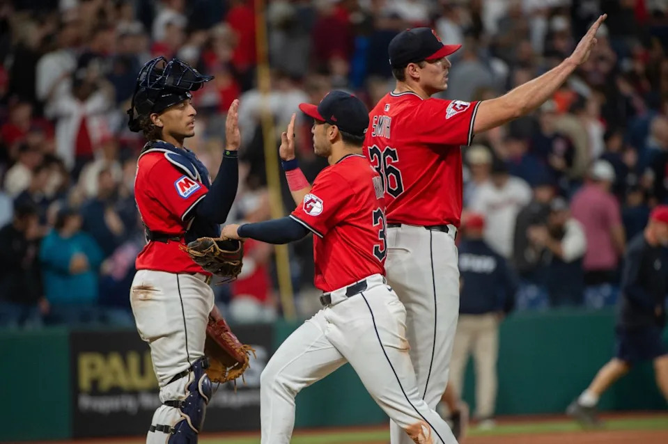 Cleveland Guardians’ Bo Naylor, left, greets Steven Kwan, center, as Cade Smith, (36) waits to congratulate more players at the end of a baseball game against the Detroit Tigers, Wednesday, Sept. 24, 2025, in Cleveland. AP