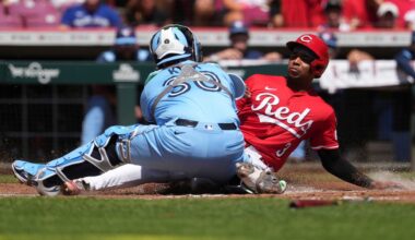 Cincinnati Reds' Ke'Bryan Hayes, right, is tagged out at home plate by Toronto Blue Jays' Alejandro Kirk, left, in the second inning of a baseball game Monday, Sept. 1, 2025, in Cincinnati. (AP Photo/Kareem Elgazzar)