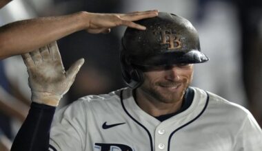 Tampa Bay Rays' Brandon Lowe celebrates in the dugout after his solo home run off Boston Red Sox pitcher Steven Matz during the sixth inning of a baseball game Sunday, Sept. 21, 2025, in Tampa, Fla. (AP Photo/Chris O'Meara)