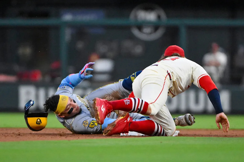 Sep 20, 2025; St. Louis, Missouri, USA; Milwaukee Brewers catcher William Contreras (24) slides safely past St. Louis Cardinals second baseman Brendan Donovan (33) for a double during the third inning at Busch Stadium. Mandatory Credit: Jeff Curry-Imagn Images